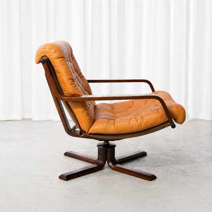 Sigurd Ressell leather and rosewood swivel lounge chair, side view