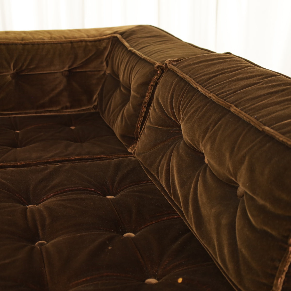 Detail of brown velvet seat and back cushions