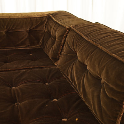 Detail of brown velvet seat and back cushions
