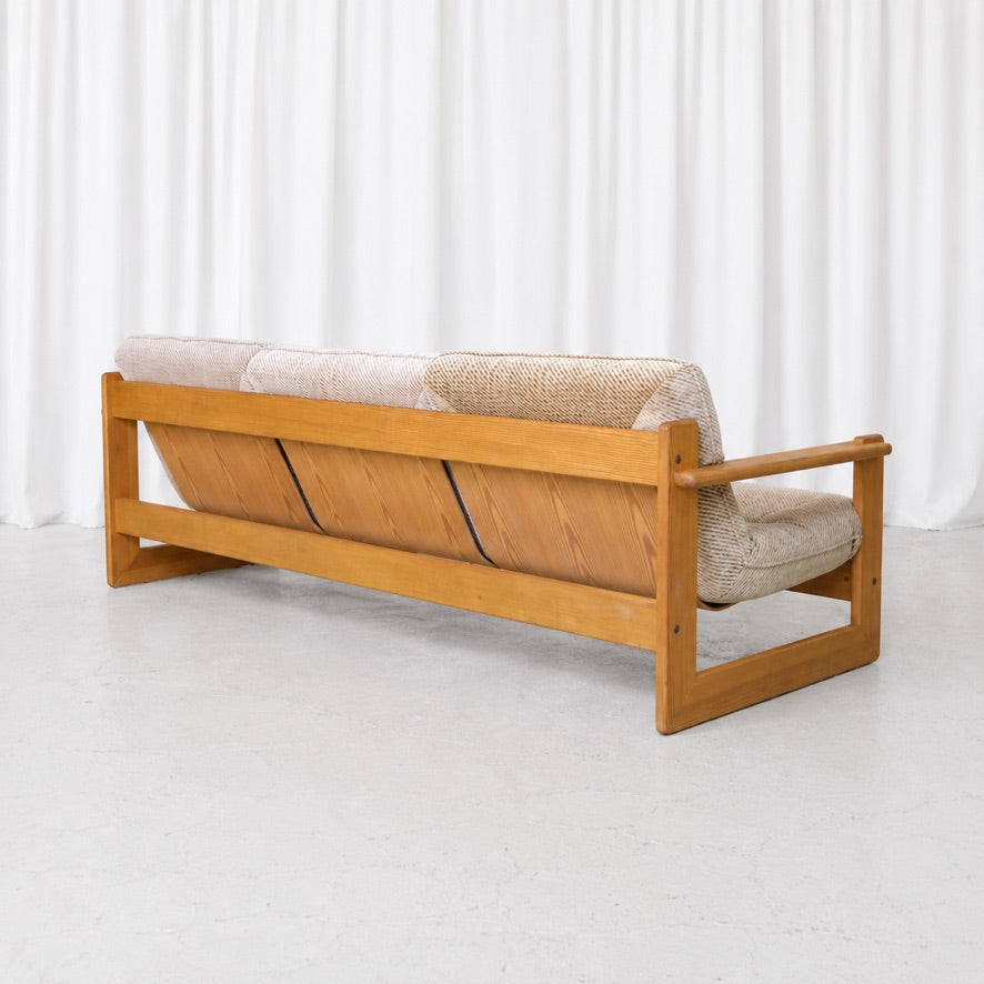 Vilka Seita sofa in lacquered pine, rear three-quarter view