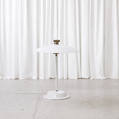 Front view of vintage table lamp with translucent acrylic shade