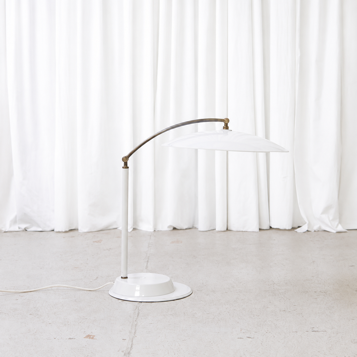 Side view of vintage adjustable white table lamp