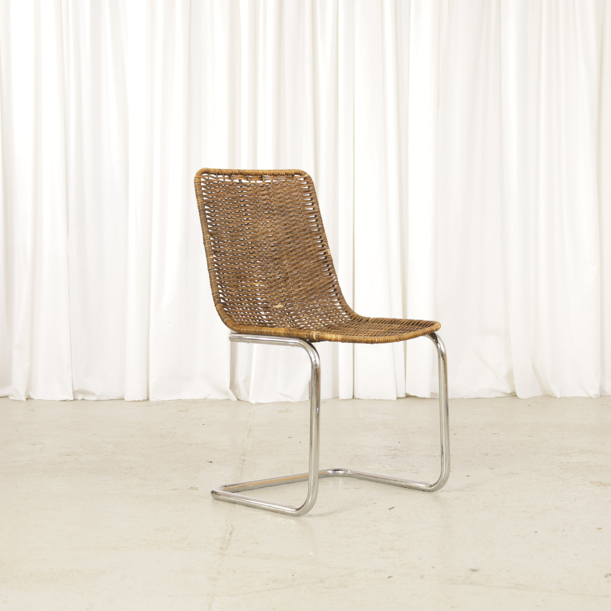 Vintage Italian Chrome and Rattan Cantilever Chair, vintage Italian chrome and rattan chair, straight-on front view