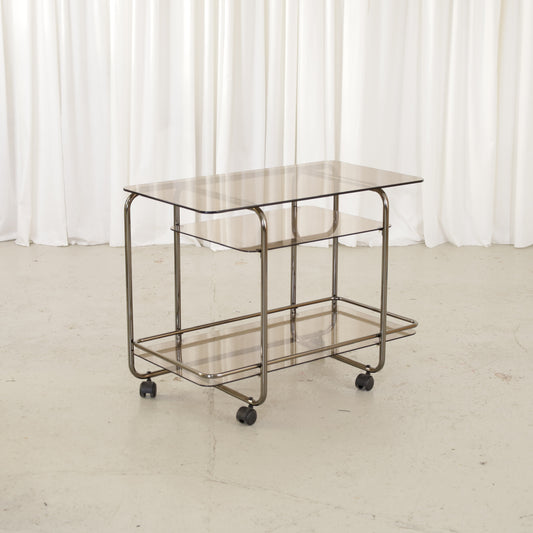 Vintage Italian-style chrome and smoked glass serving trolley, three-quarter view
