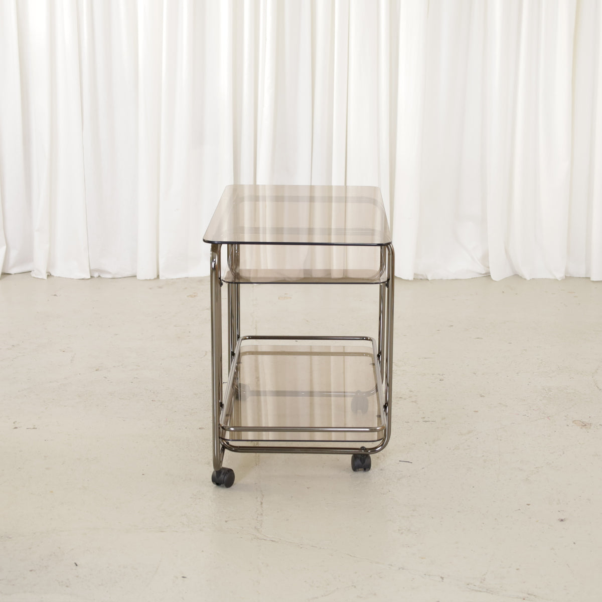 Vintage Italian-Style Chrome and Smoked Glass Serving Trolley, vintage chrome and smoked glass serving trolley, end view
