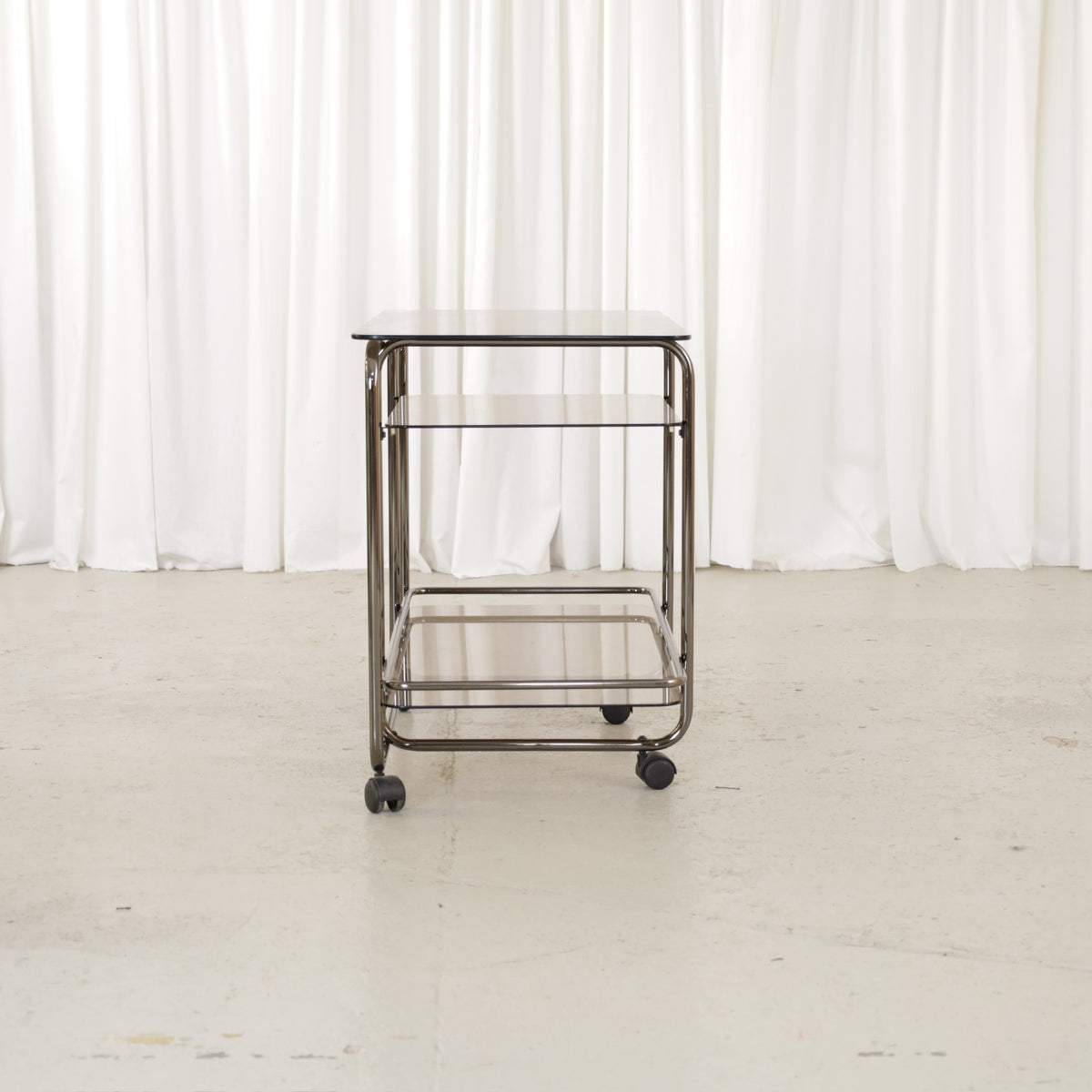 Vintage Italian-Style Chrome and Smoked Glass Serving Trolley, vintage chrome and smoked glass serving trolley, side view