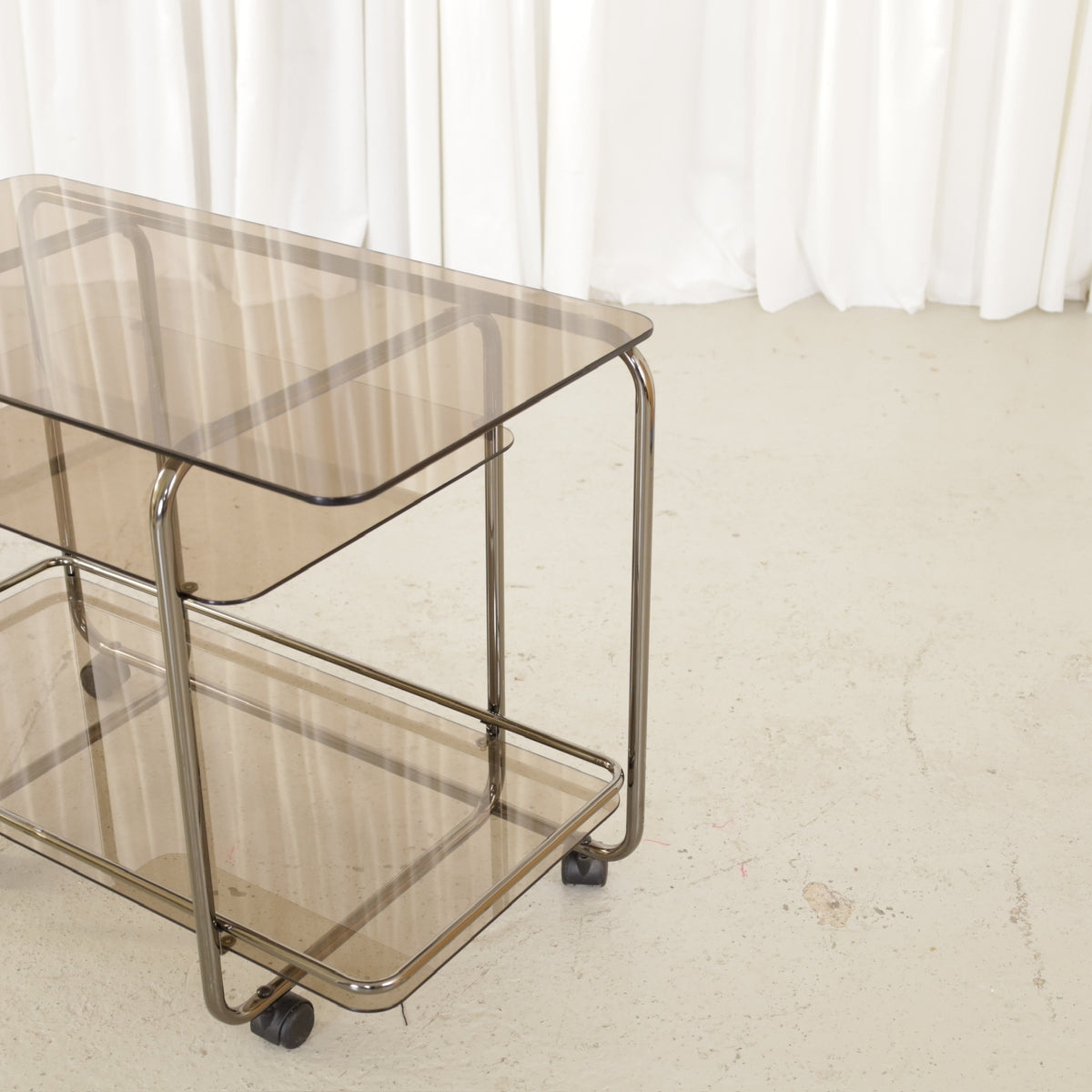 Vintage Italian-Style Chrome and Smoked Glass Serving Trolley, vintage chrome and smoked glass serving trolley, shelf and wheel detail