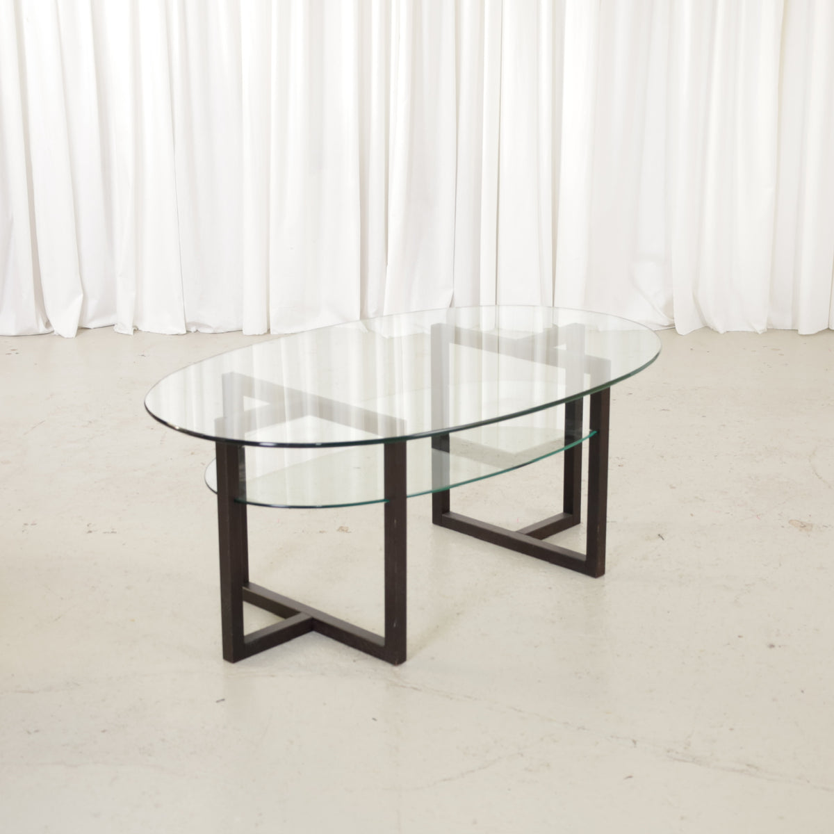 Vintage Italian-Style Oval Glass Coffee Table with Black Wooden Frame, vintage oval coffee table with black wooden frame and two clear glass tiers
