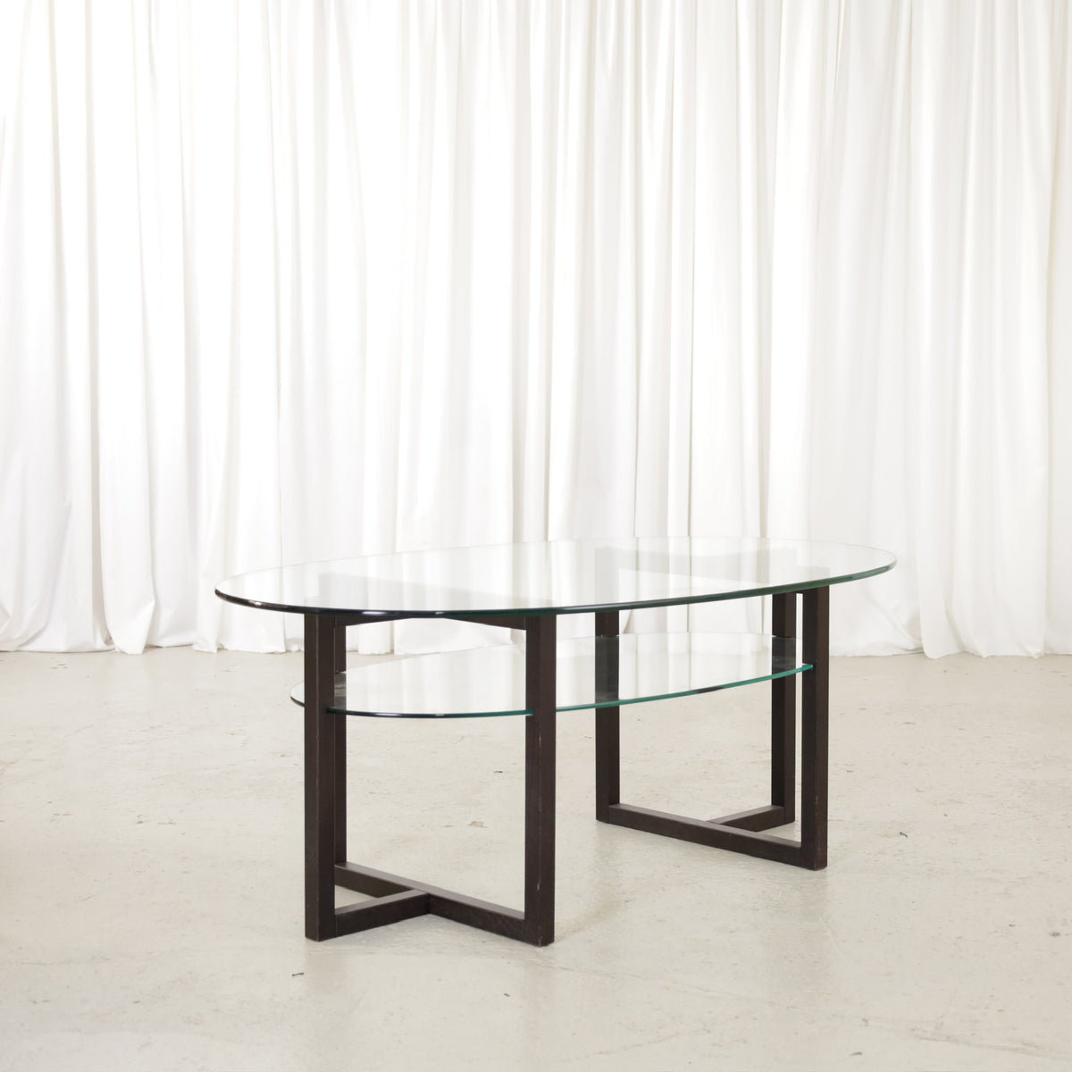 Vintage Italian-Style Oval Glass Coffee Table with Black Wooden Frame, vintage oval glass coffee table with black wooden frame, view of the two-tier