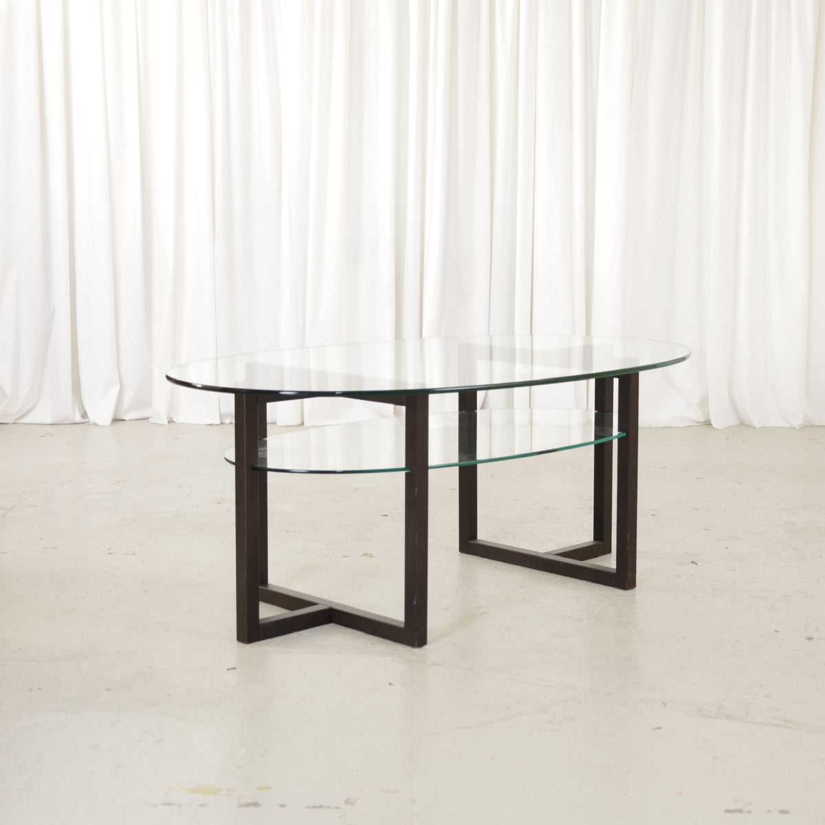 Vintage Italian-Style Oval Glass Coffee Table with Black Wooden Frame, vintage oval glass coffee table with black wooden frame, view of the two-tier