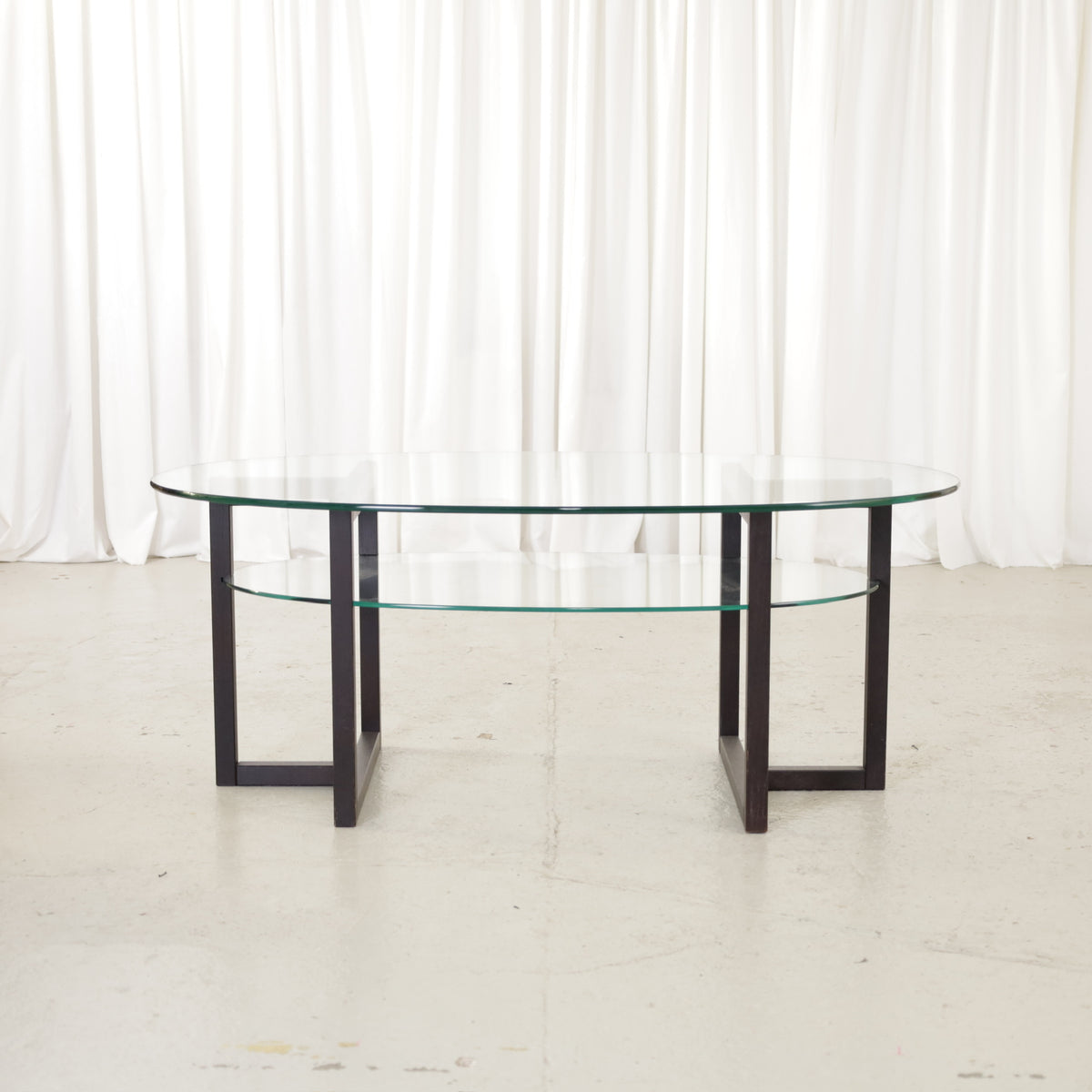 Vintage Italian-Style Oval Glass Coffee Table with Black Wooden Frame, vintage oval glass coffee table with black wooden frame, view of the two-tier