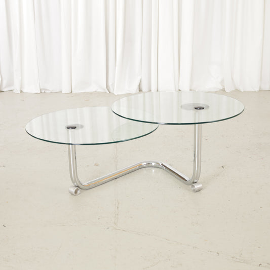Vintage Italian-style swivel glass coffee table in chrome, three-quarter view