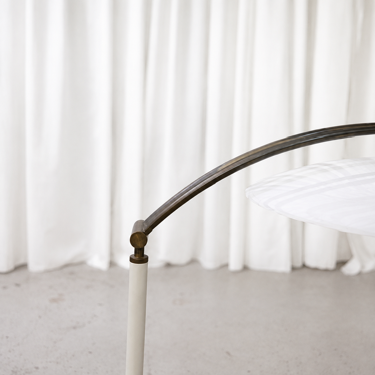 Patinated brass adjustable arm detail on vintage table lamp