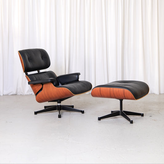Vitra Eames Lounge Chair and Ottoman in Santos palisander and black leather, front view