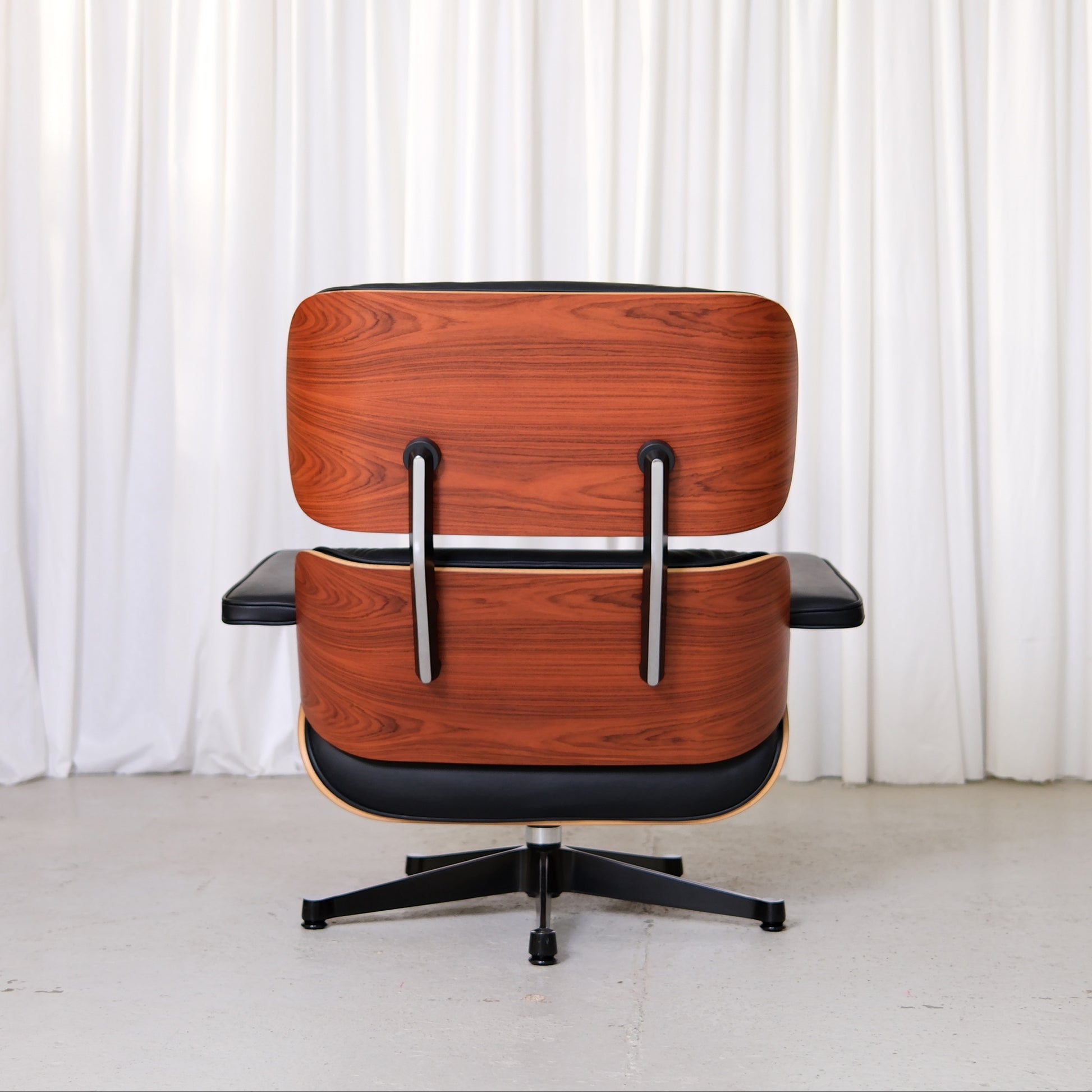 Back of Vitra Eames Lounge Chair showing Santos palisander veneer and aluminium braces