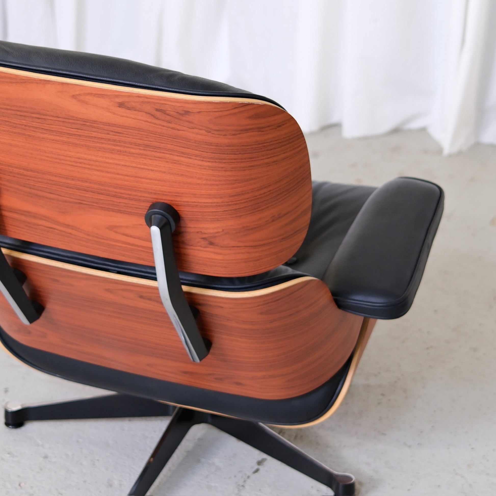 Santos palisander veneer and black leather detail on Vitra Eames Lounge Chair