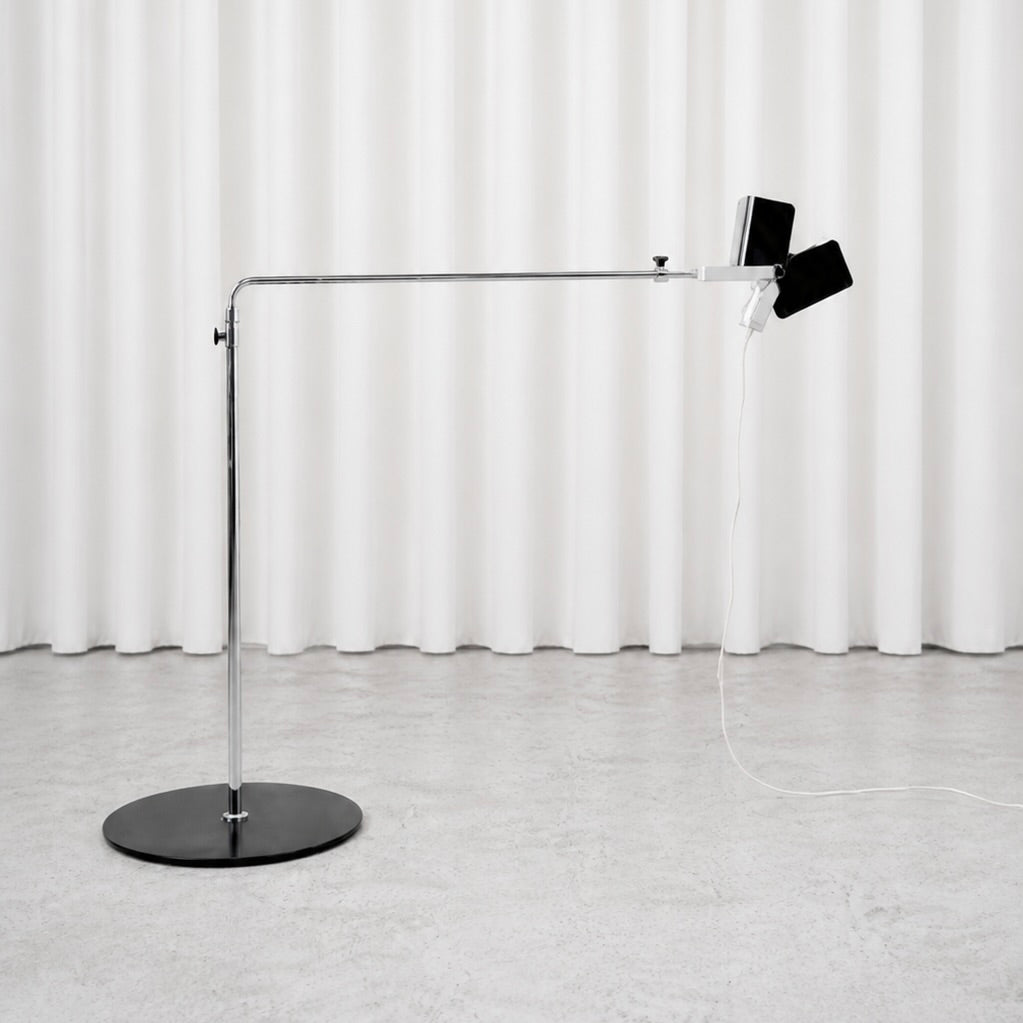 Full view of the black and chrome Yrjö Kukkapuro 100 G floor lamp
