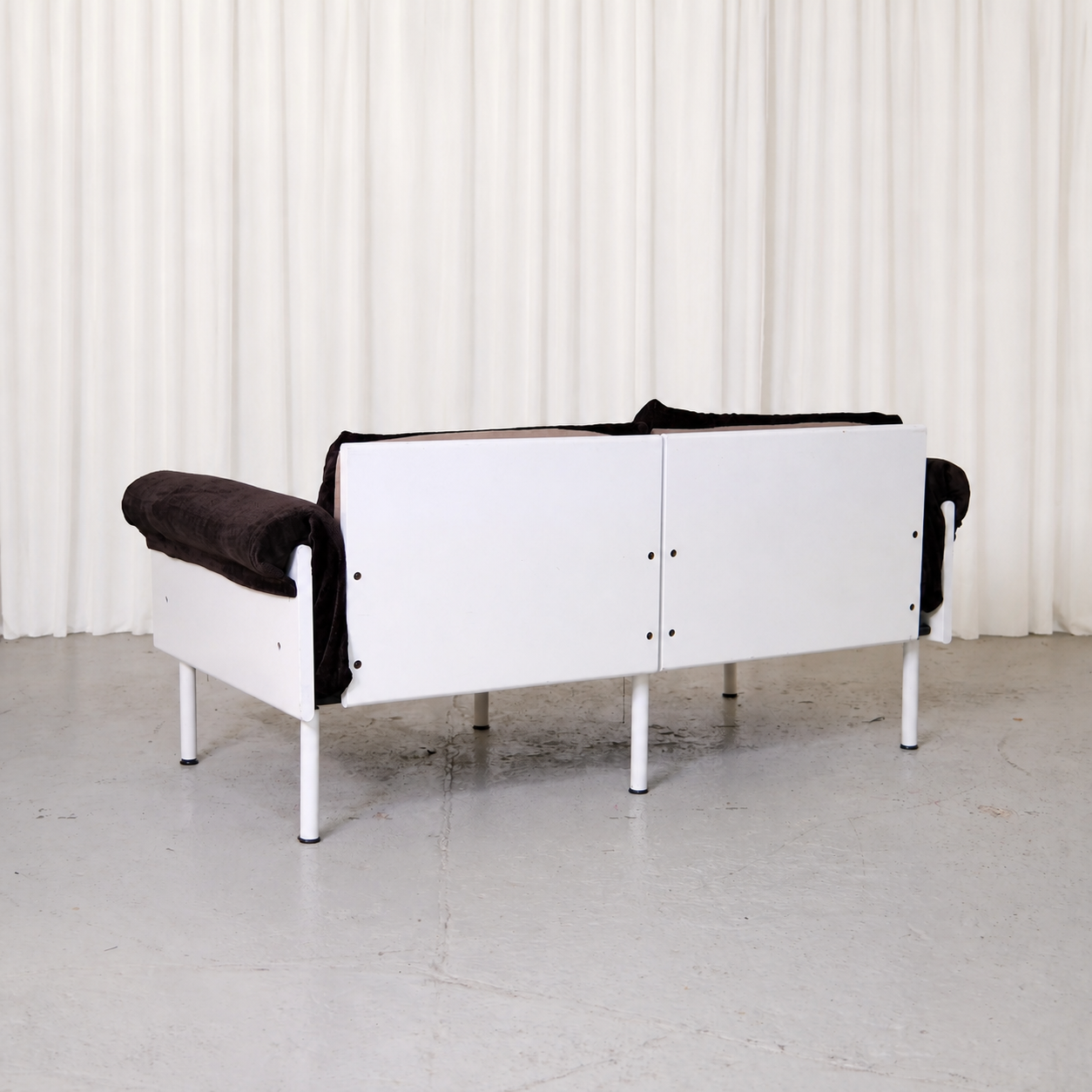 White frame of Yrjö Kukkapuro Ateljee two-seat sofa, rear view