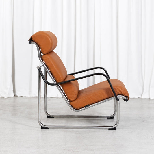 Yrjö Kukkapuro Remmi lounge chair in cognac leather, side view