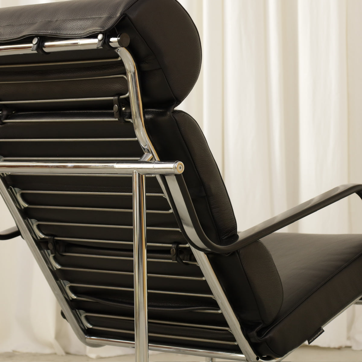 Yrjö Kukkapuro Remmi Lounge Chair with New Black Leather Cover, detail of the Remmi chair's rear frame and support straps