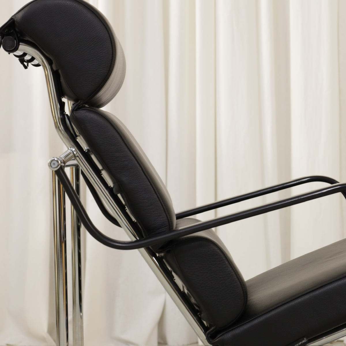 Yrjö Kukkapuro Remmi Lounge Chair with New Black Leather Cover, side detail of the Remmi backrest, headrest and armrest