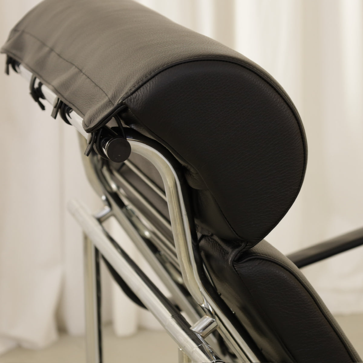 Yrjö Kukkapuro Remmi Lounge Chair with New Black Leather Cover, rear detail of the Remmi headrest and frame