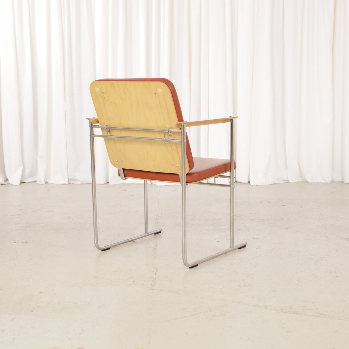 Yrjö Kukkapuro Skaala Armchair in Rust-Red Leather for Avarte, rear view of Avarte Skaala armchair showing formed birch back panel