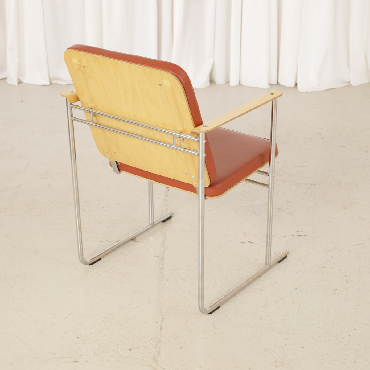Yrjö Kukkapuro Skaala Armchair in Rust-Red Leather for Avarte, rear three-quarter view of rust-red leather Skaala armchair